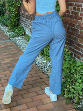 Load image into Gallery viewer, High Waisted Draw String  Linen-Look Pants igh elastic and drawstring waist. Textured with lines, Pull-on with a Faux fly.  The button tabs add to the style.  Side pockets and a cropped straight leg.  Available in Blue and Tan sizes Small, Medium, and Large
