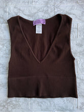 Load image into Gallery viewer, Take the plunge with this sleeveless V neck crop top. This figure-hugging top is made from a ribbed seamless fabric and features a V-shaped neckline with a cropped fit. Pair it with some sweat pants for comfort or dress it up with some jewelry and jeans! One Size.  Available in 4 Colors.  92%Nylon 8% Spandex Sleeveless V Neck Available in Blue, Brown, Yellow, and Lime
