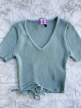 Load image into Gallery viewer, Feel like being extra? This top is for you! Add flair to your style in a comfy top with an added tie at the waist to style as you please. Looks great with a pair of jeans or even a skirt! 85% Acrylic 15% Spandex Available in 2 sizes: Small/Medium or Medium/Large  Short Sleeve Crop top Waist tie 85% Acrylic 15% Spandex
